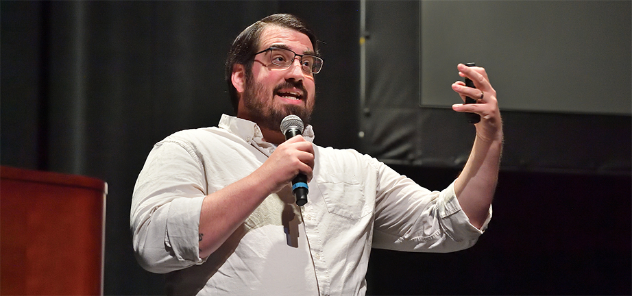 Jordan Lott conducting a training seminar from the smothers Theater stage.